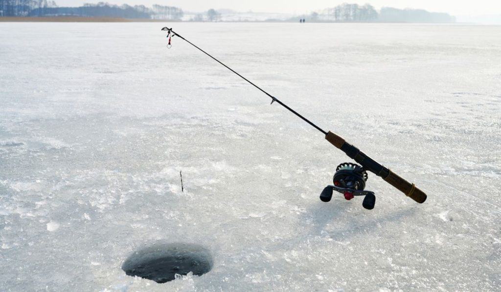 a fishing rod for ice fishing on a frozen lake

