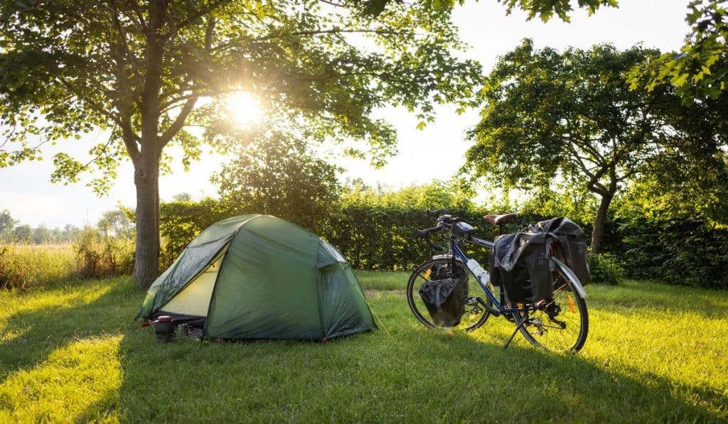 Camping spot on a bikepacking tour at sunset
