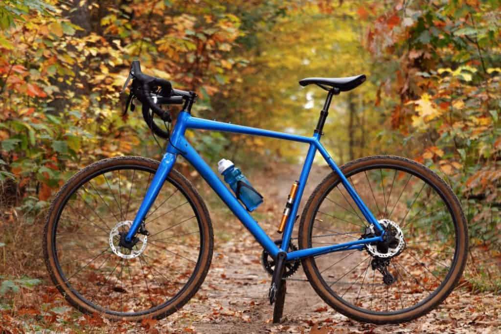 Side view of a modern gravel bicycle on a forest trail