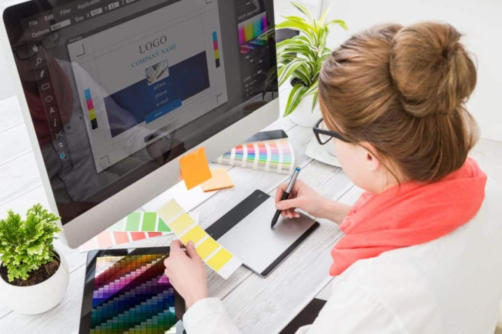 a graphic artist designing a logo