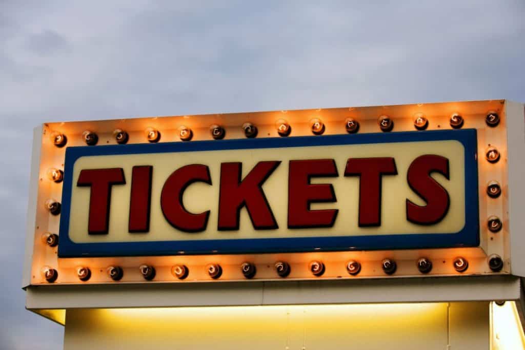 Ticket booth signage with light bulbs illuminating