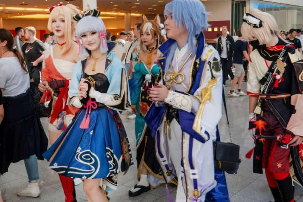 a group of young people wearing their colorful costume in an event