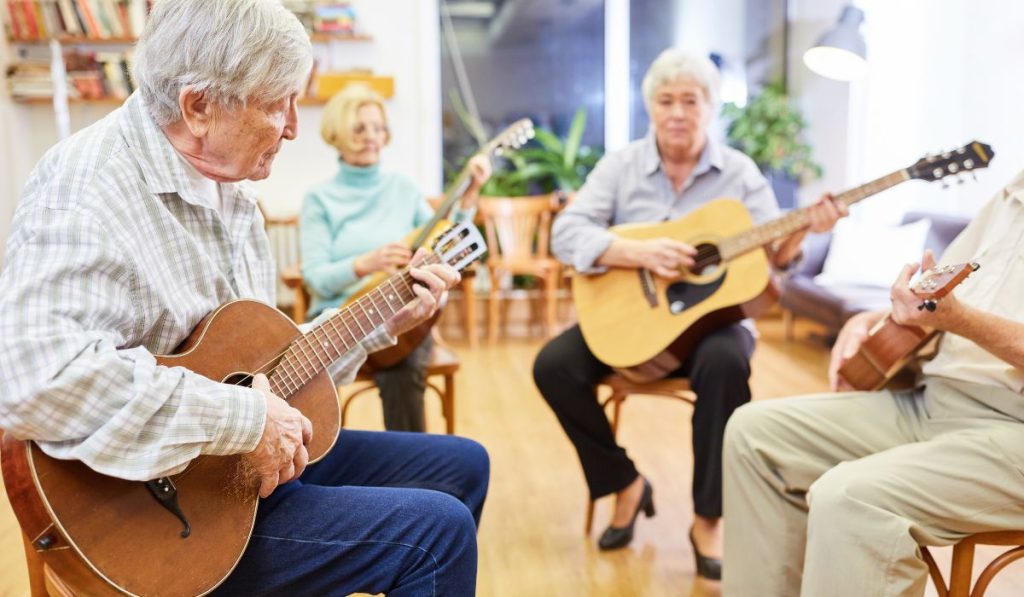 Group of seniors on guitar lessons
