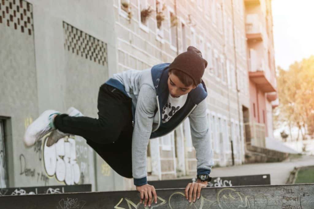 Young lad practicing parkour outdoors