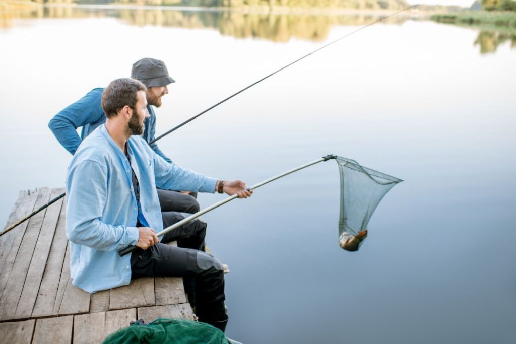 Men catching fish on the lake
