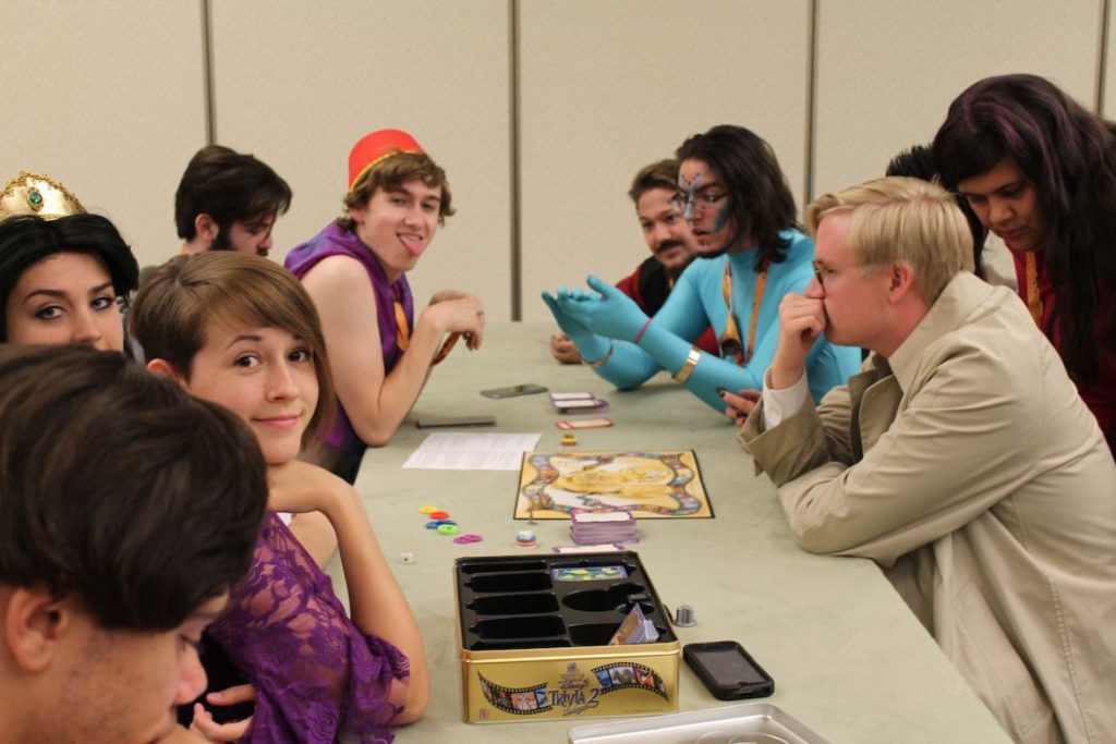 group of friends play tabletop games at Phoenix Comic Con