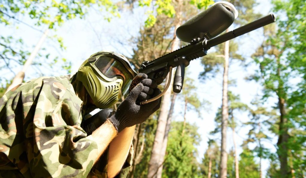 paintball player in protective uniform