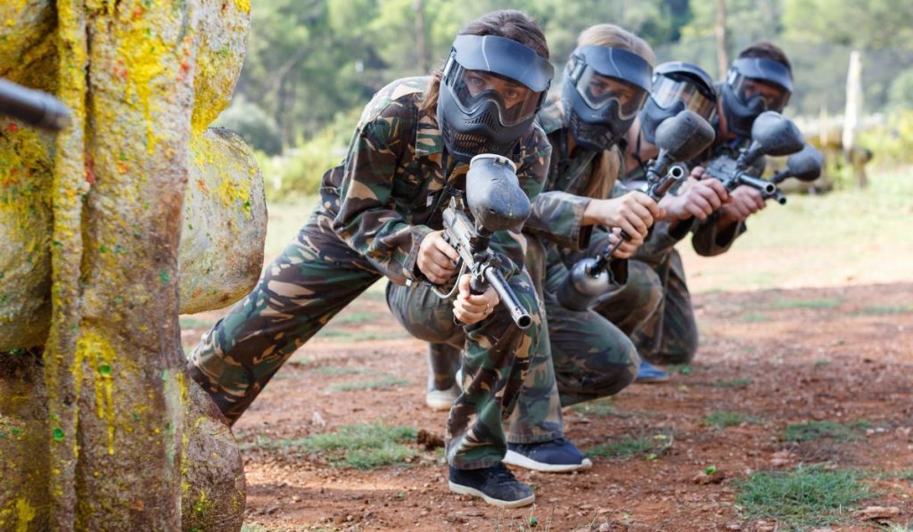 people playing on paintball battlefield outdoor